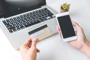 Happy Woman using smart phone and credit card register payments online shopping and customer service network connection market, using technology on laptop, Internet Online shopping or banking concept