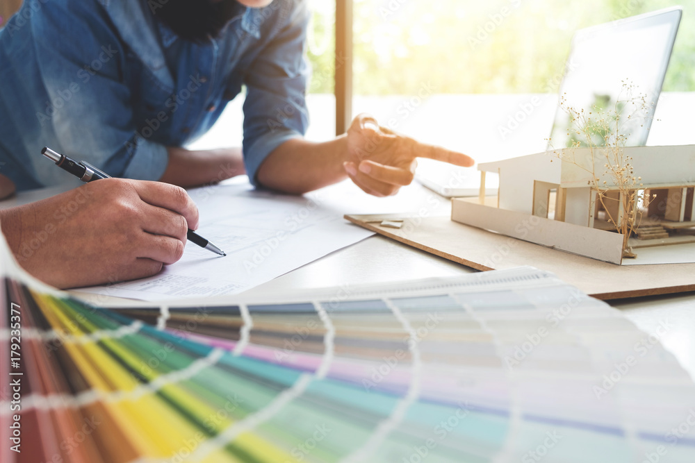 Poster two young women interior design or graphic designer working on project of architecture drawing with 