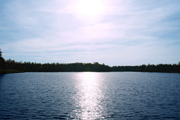 sun over an autumn lake