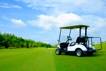 golf cart on green lawn with blue sky and cloud for background backdrop use - 179235783