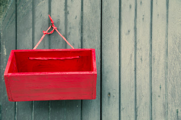 vintage red wooden mail box on vintage wooden wall