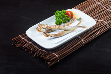 japanese cuisine. fried fish on the background