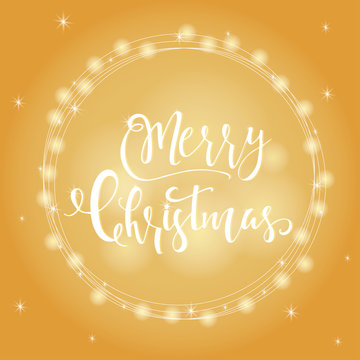 Wonderful and unique festive golden luminous background with Christmas wishes for holiday greeting cards. Hand drawn lettering with blurred bokeh.