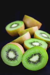 Ripe whole kiwi fruit and half kiwi fruit