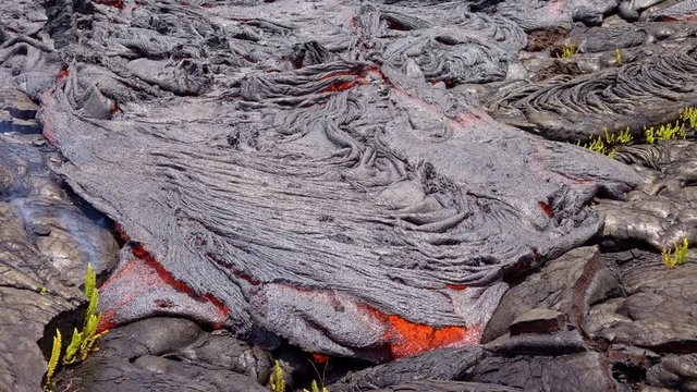 Lava lifts and flows time lapse Day daytime Glowing Hot flow from Kilauea Active Volcano Puu Oo Vent Active Volcano Magma