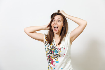 Fototapeta premium Beautiful European young funny and cheerful brown-haired woman with healthy clean skin, dressed in casual light clothes is fooling around at camera, on a white background. Emotions concept.
