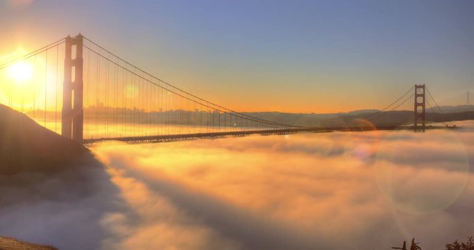 Golden Gate Bridge Spectacular Sunrise with low Fog A view of the fog pattern around San Francisco Golden Gate Bridge.