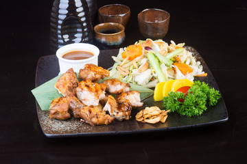 japanese cuisine. grilled chicken on the background