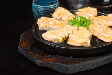 japanese cuisine. hot plate fish on the background