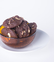 Almonds chocolate chips cookies on background