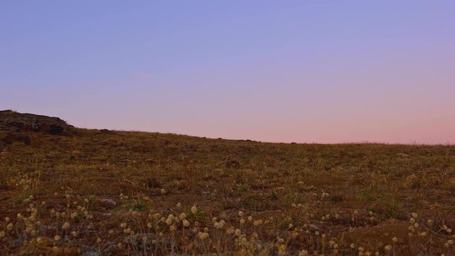 Light reveals rocky desert cliff at sunrise Kiger Gorge summit of Steens Mountain near Malheur National Wildlife Refuge