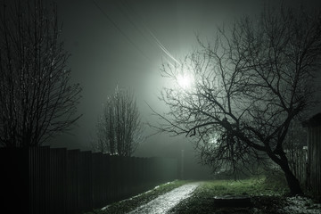 Alley in the fog in bright light