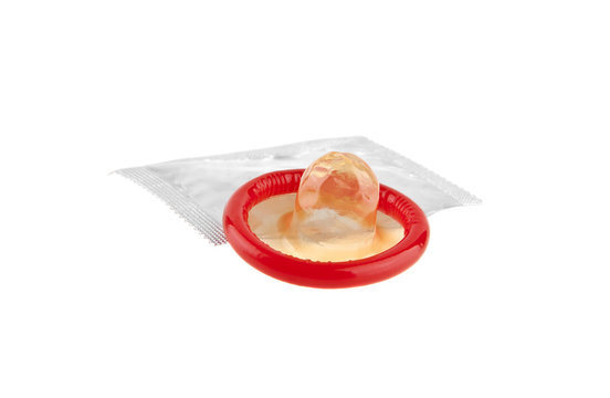 red condom isolated on white background close-up
