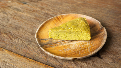 Green tea brownie on a wooden plate.