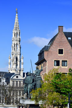 The Brabantine Gothic belfry tower of City of Brussels Town Hall at Grand Place seen from Spanish Square in Brussels, Belgium