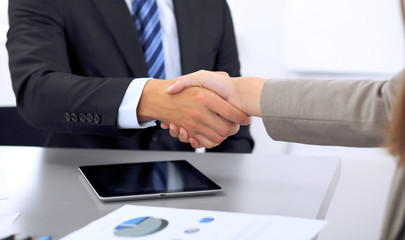 Business people shaking hands, finishing up a meeting