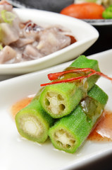 Malaysian cuisine - Okra with spicy sauce on white plate