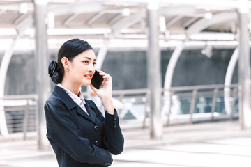 Portrait of businesswoman using smartphone