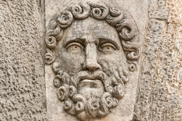 Bas-relief of a bearded man's face