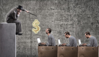 A greedy businessman motivates office workers with a salary. Office slavery concept.