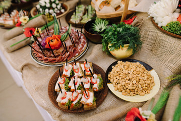 decorated catering banquet table with different food