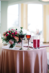 decorated wedding ceremony table glasses of wine