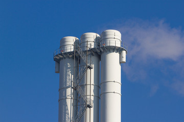 Cooling towers of nuclear power plant against the blue sky