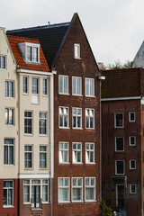 Fototapeta na wymiar View of beautiful medieval houses in Amsterdam, Holland, Europe.