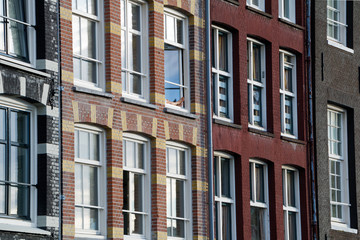 Fototapeta na wymiar View of beautiful medieval houses in Amsterdam, Netherlands, Europe.