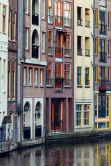 Fototapeta na wymiar View of beautiful medieval houses in Amsterdam, Netherlands, Europe.