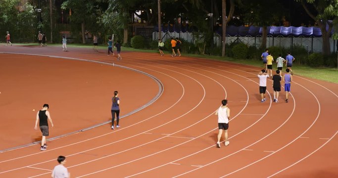 Tin Tsui Wai, Hong Kong 26 October 2017:- People jogging in Sport stadium at night