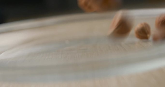 Nuts falling slowmotion &ndash; orginal file&nbsp;: 4K DCI, PRO RES 444, 12 bits