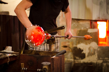 Glassworks glass manufacturing, process of forming a decorative vase 