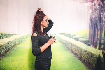 Beautiful girl drinking coffee at the coffee shop