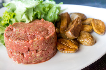 tasty Steak tartare (Raw beef) - classic steak tartare on white plate