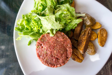 tasty Steak tartare (Raw beef) - classic steak tartare on white plate