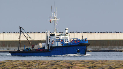 DREDGER - A small ship enters the port © Wojciech Wrzesień