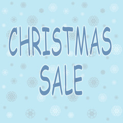 Christmas advertising text with snowflakes on blue winter sky. 