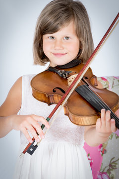 Girl enjoying playing a violine