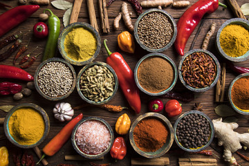 Variety of spices and herbs on kitchen table