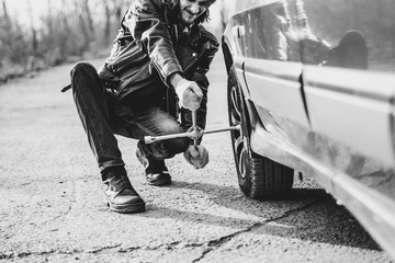 man changing wheel on a car