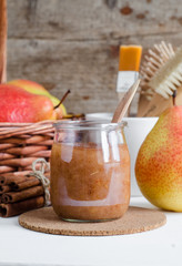 Homemade pear and cinnamon mask in a glass jar. Diy cosmetics. Copy space.