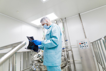 scientist in checking the readings