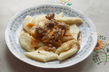 potato noodles with beef goulash and sauce