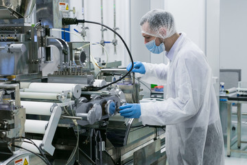 scientist work with manufacture machine