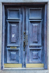 Fototapeta na wymiar Old worn purple and lilac solid wooden door background
