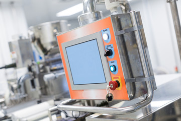 big steel machine with shafts and control panel