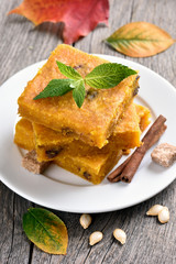 Sliced pumpkin pie with nuts