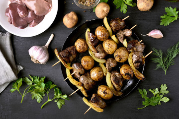 Chicken liver and vegetables on skewers