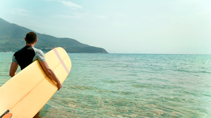 the guy surfing in the hands of the ocean